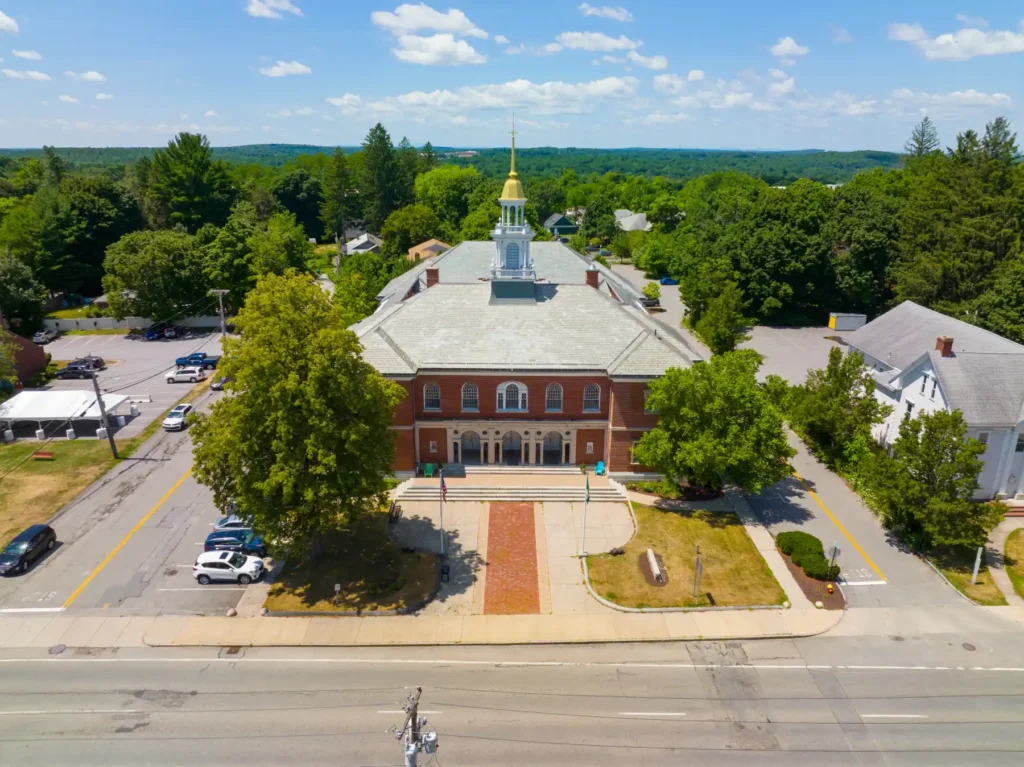 Aerial View Historic Brick Town Hall with Clock Tower Spire and Paved Courtyard.jpg