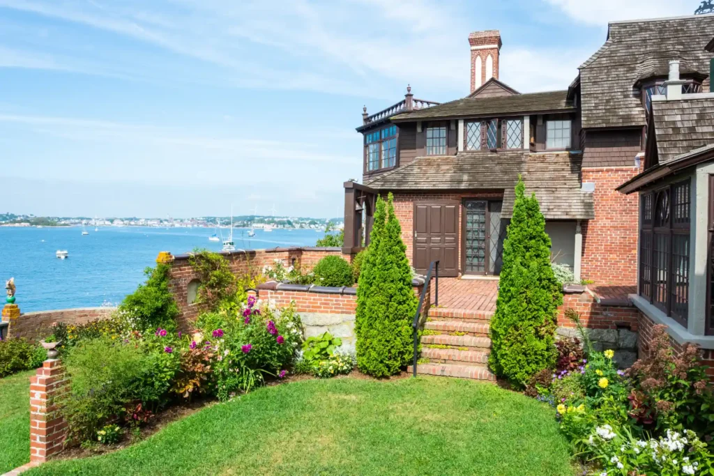 Historic Brick Oceanfront Estate with Shingle Roof Terraced Garden and Bay View.jpg